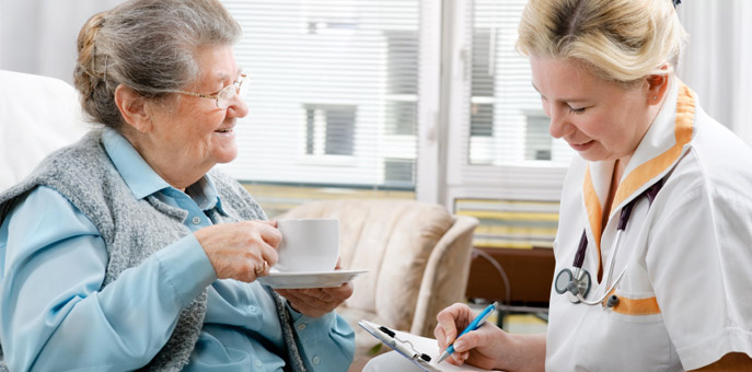 two women talking over coffee